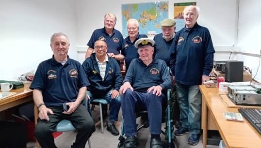 Stan McNally (front, wearing Merchant Navy cap) and the other radio club members celebrate the opening of their new home at Mariners' Park. Image: Nautilus International Image:Stan McNally (front, wearing Merchant Navy cap) and the other radio club members celebrate the opening of their new home at Mariners' Park. Image: Nautilus International