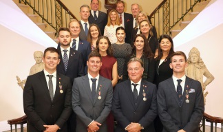 Yacht crew Medal recipients (front) with colleagues, family and friends. Image:Yacht crew Medal recipients (front) with colleagues, family and friends.