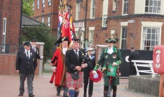 The piper Dale McLean leads the Parade of Standards onto the pier with the Lord Mayor and Admiral of the Humber. Also in attendance were other dignitaries, and local representatives of the Merchant Navy, Royal Navy and fishing fleets. Image:The piper Dale McLean leads the Parade of Standards onto the pier with the Lord Mayor and Admiral of the Humber. Also in attendance were other dignitaries, and local representatives of the Merchant Navy, Royal Navy and fishing fleets.