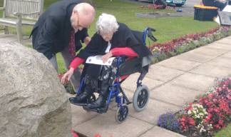 Nautilus Care Home resident Kate Hurley and her son Ian Hurley lay a wreath at the Atlantic Stone. Image:Nautilus Care Home resident Kate Hurley and her son Ian Hurley lay a wreath at the Atlantic Stone.