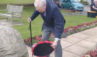 Mariners' Park Estate resident John Davidson lays a wreath at the Atlantic Stone. Image:Mariners' Park Estate resident John Davidson lays a wreath at the Atlantic Stone.