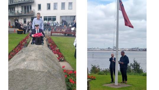 At left: Former Merchant Navy officer Stan McNally, a Nautilus Care Home resident, accompanied by Keith Newey, his son-in-law, lays a wreath at the Atlantic Stone at Mariners' Park in Wallasey, UK. Right: Alex Harrison, a former master mariner, lowered and raised the flag accompanied by head gardener Dave Crawford. Images: Nautilus International except where stated. Image:At left: Former Merchant Navy officer Stan McNally, a Nautilus Care Home resident, accompanied by Keith Newey, his son-in-law, lays a wreath at the Atlantic Stone at Mariners' Park in Wallasey, UK. Right: Alex Harrison, a former master mariner, lowered and raised the flag accompanied by head gardener Dave Crawford. Images: Nautilus International except where stated.
