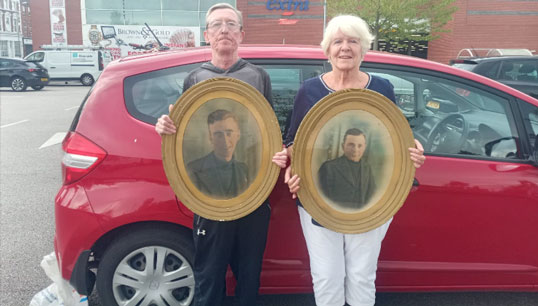 Allen Gibbons and Margaret Farrell with the photos found by Sheila Hurst of Allen's father Peter and his brother George Gibbons. Image:Allen Gibbons and Margaret Farrell with the photos found by Sheila Hurst of Allen's father Peter and his brother George Gibbons.