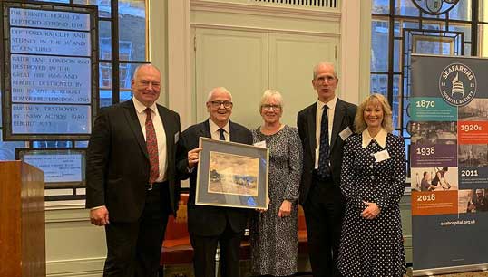 Former deputy general secretary of Nautilus International Peter McEwen holds a watercolour painting gifted to him at a drinks reception hosted by Trinity House for the SHS bicentennial celebrations. Beside him at left is incoming chair Captain Kuba Szymanski. The others are from left: Carole McEwen (Mr McEwen's wife), Sandy Nairne (deputy chair), Sandra Welch (CEO). Image: SHS Image:Former deputy general secretary of Nautilus International Peter McEwen holds a watercolour painting gifted to him at a drinks reception hosted by Trinity House for the SHS bicentennial celebrations. Beside him at left is incoming chair Captain Kuba Szymanski. The others are from left: Carole McEwen (Mr McEwen's wife), Sandy Nairne (deputy chair), Sandra Welch (CEO). Image: SHS