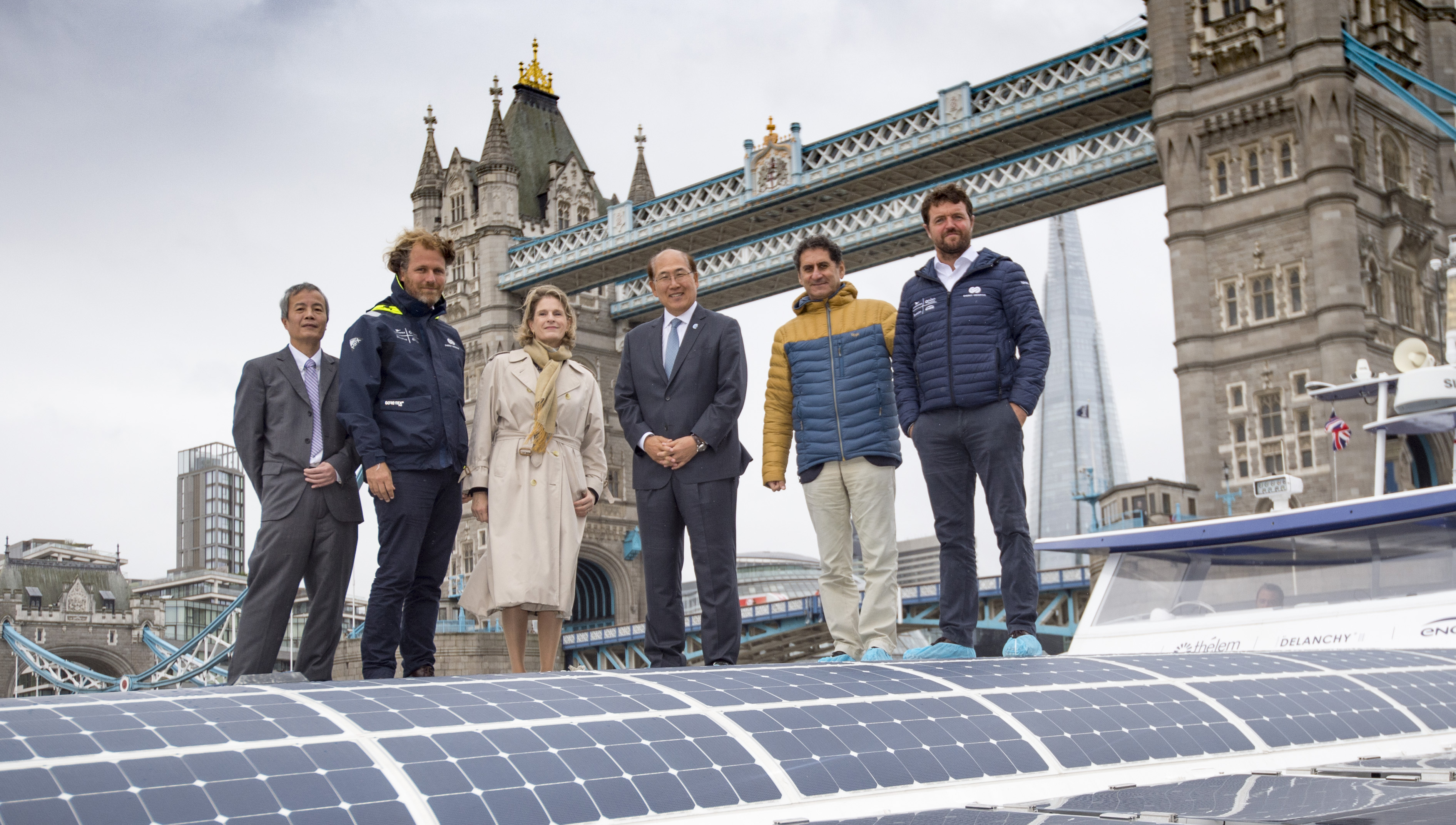 Members of the expedition team and guests from the IMO at its London berth on the Thames, from left: Jérôme Delafosse, Geneviève Van Rossum, Kitack Lim, Francesco La Camera, Victorien Erussard, onboard the Energy Observer. Credit Lloyd Images Image:Members of the expedition team and guests from the IMO at its London berth on the Thames, from left: Jérôme Delafosse, Geneviève Van Rossum, Kitack Lim, Francesco La Camera, Victorien Erussard, onboard the Energy Observer. Credit Lloyd Images