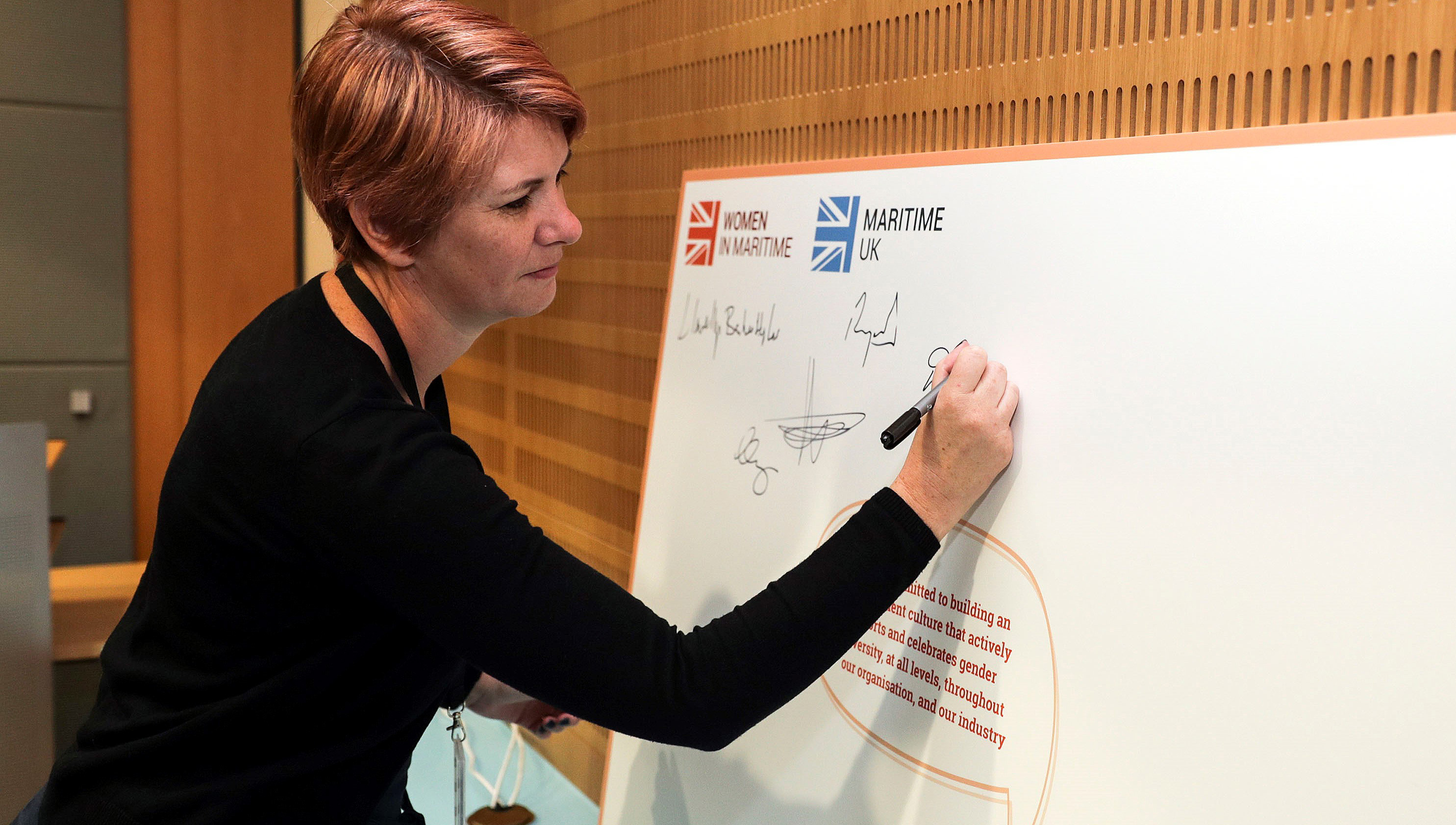 Nautilus head of strategy Debbie Cavaldoro signs the pledge on behalf of the Union. Image:Nautilus head of strategy Debbie Cavaldoro signs the pledge on behalf of the Union.
