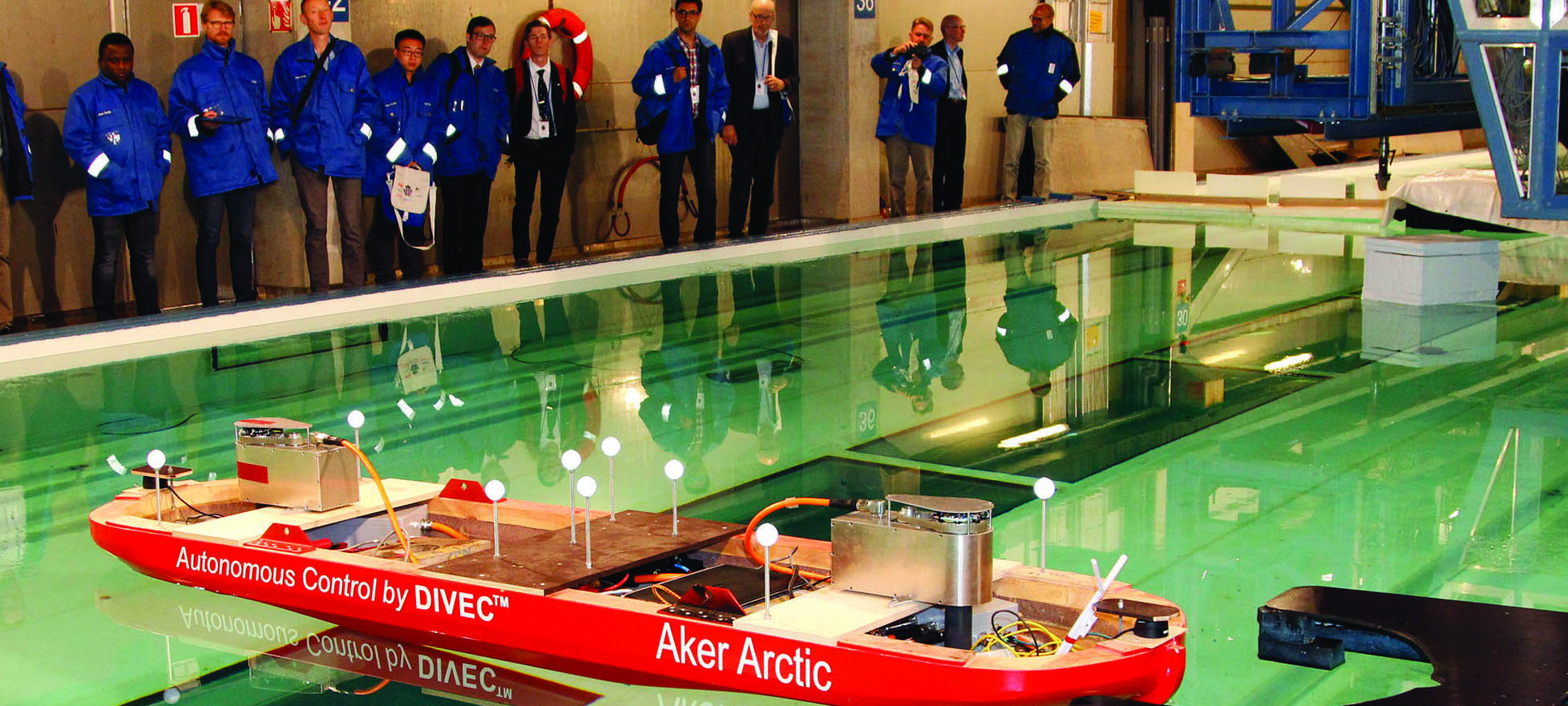 The Finnish firm Aker Arctic has demonstrated an autonomous ship model – pictured – showing its ability to detect obstacles and manoeuvre around them without operator input.
The model vessel used onboard sensors to avoid the obstacles and to moor itself automatically to a target pier in Aker Arctic's test laboratory in Helsinki. The company said the tests were a step forward in the development of autonomous shipping and the technology used in the tests in the laboratory can be adapted to semi and full scale prototypes. Image:The Finnish firm Aker Arctic has demonstrated an autonomous ship model – pictured – showing its ability to detect obstacles and manoeuvre around them without operator input.
The model vessel used onboard sensors to avoid the obstacles and to moor itself automatically to a target pier in Aker Arctic's test laboratory in Helsinki. The company said the tests were a step forward in the development of autonomous shipping and the technology used in the tests in the laboratory can be adapted to semi and full scale prototypes.