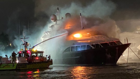 Firefighters attempt to extinguish the blaze aboard the yacht Andiamo, which was caused by two candles and exacerbated by poor maintenance of fire safety equipment. Image: US Coast Guard Image:Firefighters attempt to extinguish the blaze aboard the yacht Andiamo, which was caused by two candles and exacerbated by poor maintenance of fire safety equipment. Image: US Coast Guard