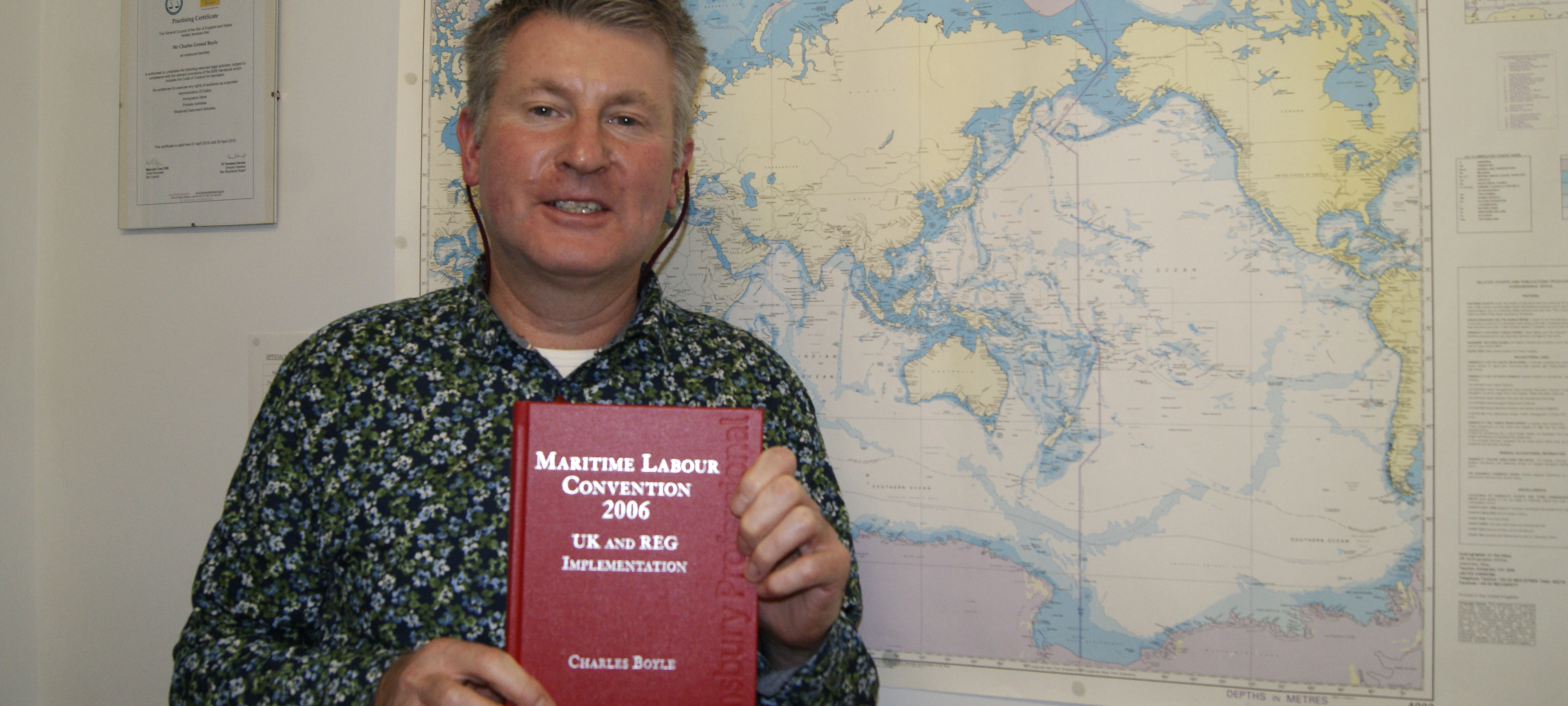 Charles Boyle, director of Nautilus legal services, with a copy of his book on the MLC. Image:Charles Boyle, director of Nautilus legal services, with a copy of his book on the MLC.