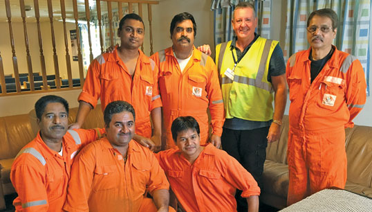 Paul Keenan (in yellow hi-vis) in September 2016 with seafarers onboard the detained offshore supply vessel Malaviya Twenty. As ITF inspector for the east of England, Paul led the operation to arrest the vessel in Great Yarmouth, recover the wages owed and repatriate the crew. Image:Paul Keenan (in yellow hi-vis) in September 2016 with seafarers onboard the detained offshore supply vessel Malaviya Twenty. As ITF inspector for the east of England, Paul led the operation to arrest the vessel in Great Yarmouth, recover the wages owed and repatriate the crew.