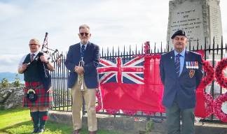 At the war memorial near Tarbert on Loch Fyne, Argyll, Scotland. L-R: John Hunt (piper), Kevin MacKaveney (who performed the Reveille), and Aggie Dennis who related the history of and sacrifices by the Merchant Navy and who read the Kohima Epitaph. Image: Kevin MacKaveney Image:At the war memorial near Tarbert on Loch Fyne, Argyll, Scotland. L-R: John Hunt (piper), Kevin MacKaveney (who performed the Reveille), and Aggie Dennis who related the history of and sacrifices by the Merchant Navy and who read the Kohima Epitaph. Image: Kevin MacKaveney