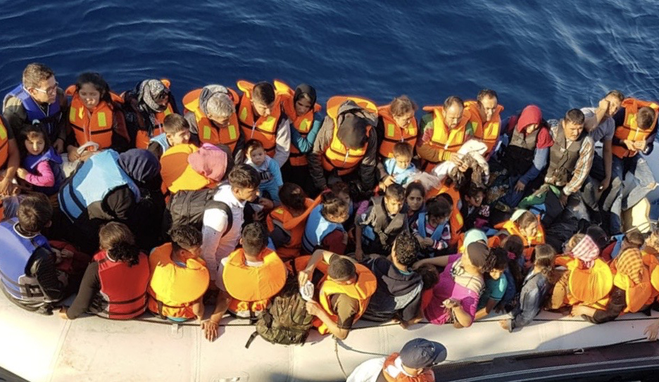 Migrants in a dangerously overcrowded dinghy witnessed by third officer Ross Cleland - including disabled and elderly people and very young children Image:Migrants in a dangerously overcrowded dinghy witnessed by third officer Ross Cleland - including disabled and elderly people and very young children