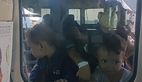 ross_cleland_migrant_rescue_kids_window.jpg ross_cleland_migrant_rescue_kids_window.jpg