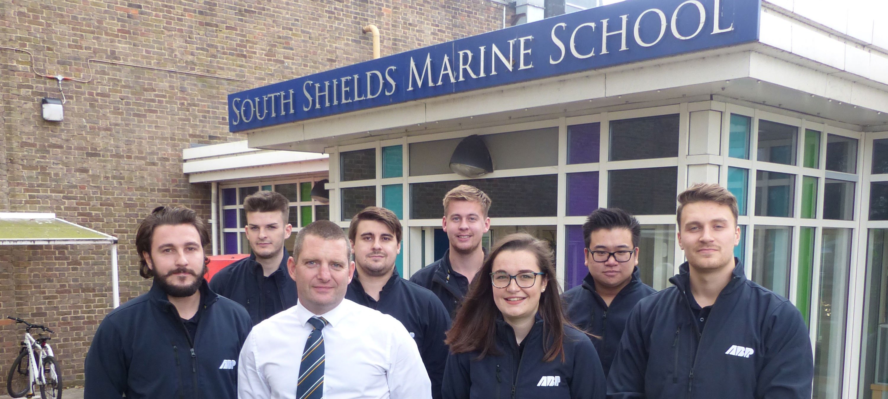 Jon Milner, head of school for deck officer certification, with Associated British Ports (ABP) apprentices Izzy Waterfall, Matt Rattenbury, Gar-Wai Wong, Elliott Jones, Joe Dickinson, Alex Holliday, and Will Parker. They are attending the school for two terms of a new, three-year Port Operations Officer training programme.
Image:Jon Milner, head of school for deck officer certification, with Associated British Ports (ABP) apprentices Izzy Waterfall, Matt Rattenbury, Gar-Wai Wong, Elliott Jones, Joe Dickinson, Alex Holliday, and Will Parker. They are attending the school for two terms of a new, three-year Port Operations Officer training programme.