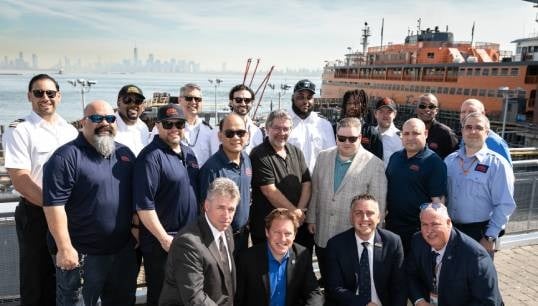 Caption: The crew of the Sandy Ground with MEBA president Adam Vokac (front,centre left) and secretary-treasurer Roland Rexha (front, centre right). Image: MEBA Image:Caption: The crew of the Sandy Ground with MEBA president Adam Vokac (front,centre left) and secretary-treasurer Roland Rexha (front, centre right). Image: MEBA