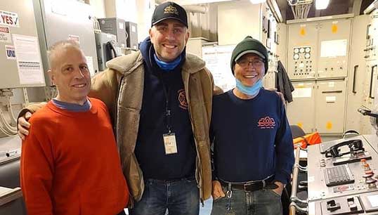 Roland Rexha (middle) with Staten Island Ferry workers. Image: Marine Engineers' Beneficial Association Image:Roland Rexha (middle) with Staten Island Ferry workers. Image: Marine Engineers' Beneficial Association