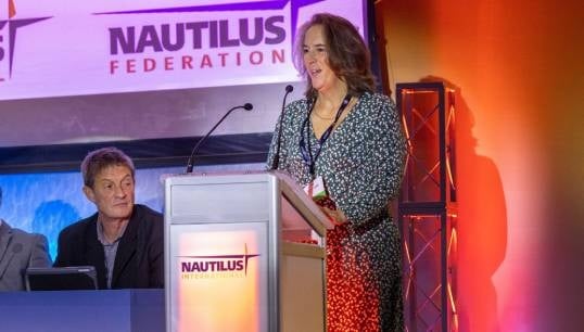 Nautilus Council member Captain Jessica Tyson proposing the motion Charting a Just Transition for Maritime Professionals to the 2023 Nautilus International General Meeting. Image: Brad Wakefield Image:Nautilus Council member Captain Jessica Tyson proposing the motion Charting a Just Transition for Maritime Professionals to the 2023 Nautilus International General Meeting. Image: Brad Wakefield