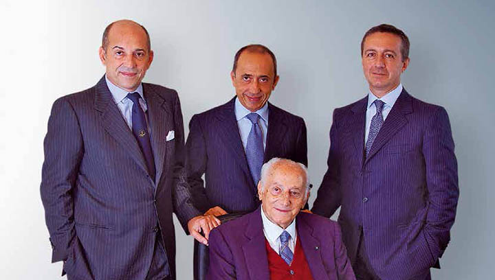 Grimaldi senior management, from left: Emanuele Grimaldi, Gianluca Grimaldi, Diego Pacella and (seated) Guido Grimaldi. Image:Grimaldi senior management, from left: Emanuele Grimaldi, Gianluca Grimaldi, Diego Pacella and (seated) Guido Grimaldi.