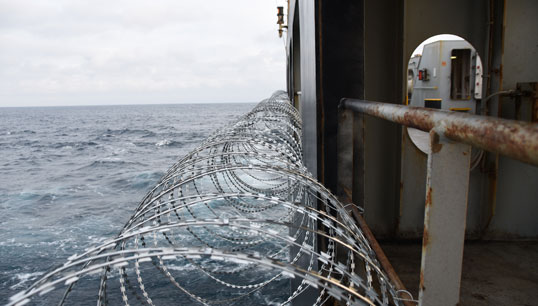 Piracy defence: barbed wire is often attached to a ship hull, superstructure and railings to protect crew against piracy attack in the Gulf of Guinea in West Africa. Image: Getty Images Image:Piracy defence: barbed wire is often attached to a ship hull, superstructure and railings to protect crew against piracy attack in the Gulf of Guinea in West Africa. Image: Getty Images