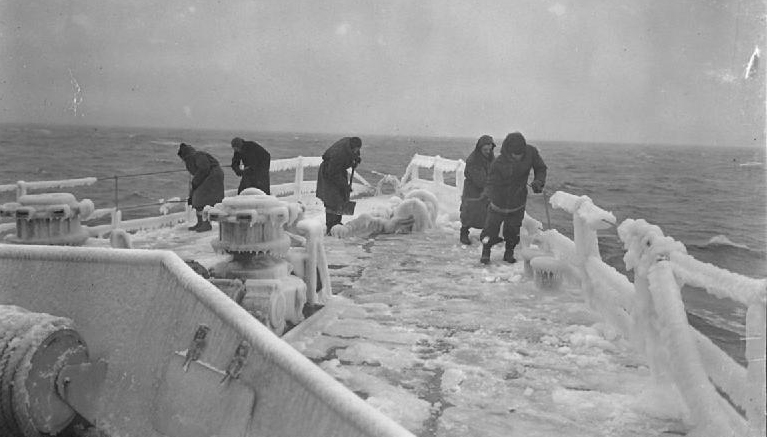 Members of the crew clearing the frozen deck of HMS Inglefield during convoy duty in Arctic waters - a task also endured by seafarers on the convoys' Merchant Navy vessels. Image: Lt F.A. Hudson / Wikimedia Commons
Image:Members of the crew clearing the frozen deck of HMS Inglefield during convoy duty in Arctic waters - a task also endured by seafarers on the convoys' Merchant Navy vessels. Image: Lt F.A. Hudson / Wikimedia Commons