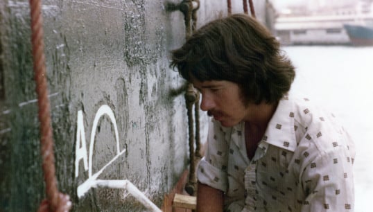 Image:Nautilus member Trevor Boult painting a Plimsoll line onto a vessel as a cadet in the 1970s. Image: courtesy of Trevor Boult