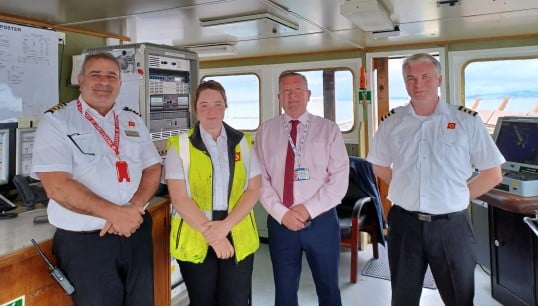 From left to right: MV Isle of Arran’s captain, Jay Shibel; 3rd officer Rowanne MacLachlan; Nautilus head of Industrial Micky Smyth; and the vessel’s chief officer Edward MacLeod. Image: Nautilus International Image:From left to right: MV Isle of Arran’s captain, Jay Shibel; 3rd officer Rowanne MacLachlan; Nautilus head of Industrial Micky Smyth; and the vessel’s chief officer Edward MacLeod. Image: Nautilus International