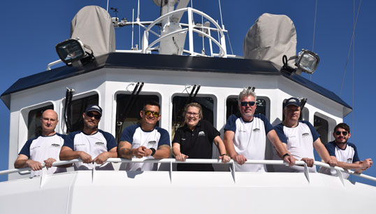 The MV Astra crew shortly before departing Lanzarote for the Southern Capes circumnavigation. L-R: Luke Crossley (chief engineer), Orlando Perez Lopez (staff captain), Carlos Casola (junior watch officer), Kat Heathcote (designated person ashore), Iain Macneil (captain), Paul Griffiths (chief engineer), Michael Napier (chief mate). Image:The MV Astra crew shortly before departing Lanzarote for the Southern Capes circumnavigation. L-R: Luke Crossley (chief engineer), Orlando Perez Lopez (staff captain), Carlos Casola (junior watch officer), Kat Heathcote (designated person ashore), Iain Macneil (captain), Paul Griffiths (chief engineer), Michael Napier (chief mate).