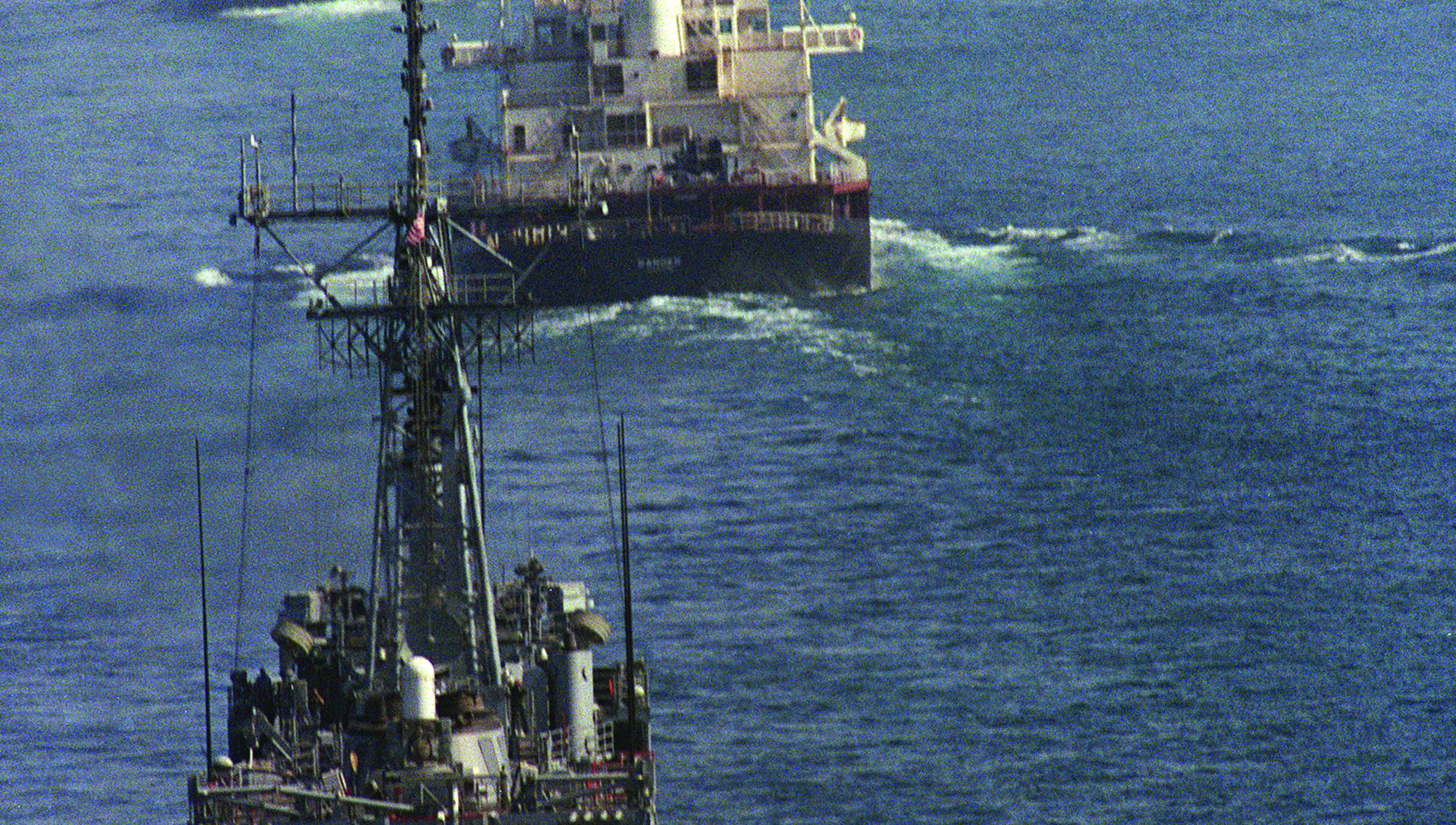 Convoy of reflagged tankers off Dubai escorted by a US warship ship during the 1980's 'tanker war' Gulf conflict: Image: Getty Images Image:Convoy of reflagged tankers off Dubai escorted by a US warship ship during the 1980's 'tanker war' Gulf conflict: Image: Getty Images