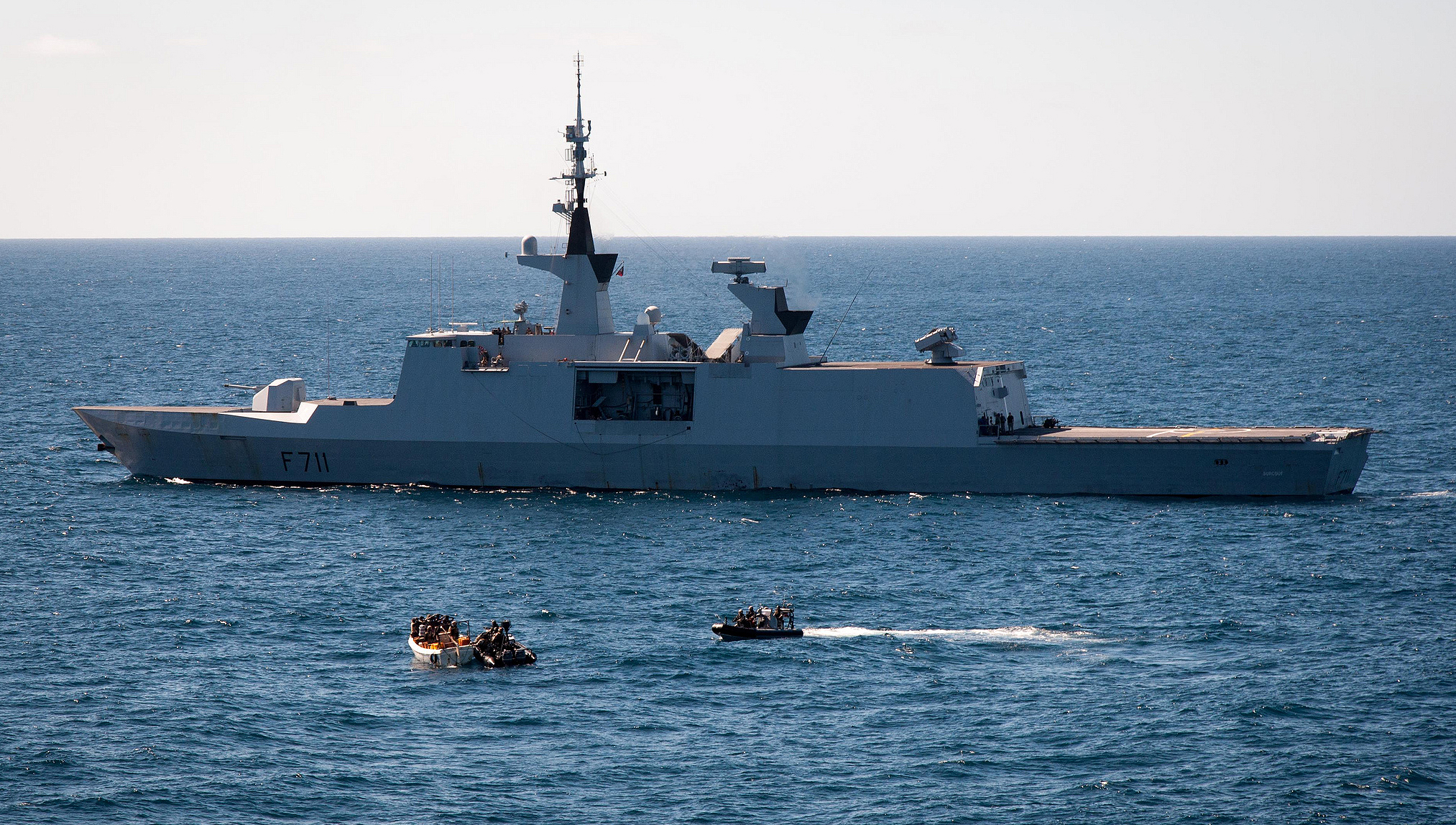 EU Naval Force French Frigate Surcouf and NATO Warship USS Halyburton work together to apprehend twelve suspected pirates. Credit EUNAVOR Flickr album – EU Naval Force Actions Image:EU Naval Force French Frigate Surcouf and NATO Warship USS Halyburton work together to apprehend twelve suspected pirates. Credit EUNAVOR Flickr album – EU Naval Force Actions