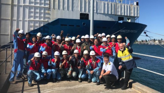 The crew of the Yangtze Fortune, pictured with ITF volunteer Graham 'Yappy' Archer (right). They returned home after a five month long abandonment ordeal following intervention from the ITF. Image: ITF Image:The crew of the Yangtze Fortune, pictured with ITF volunteer Graham 'Yappy' Archer (right). They returned home after a five month long abandonment ordeal following intervention from the ITF. Image: ITF