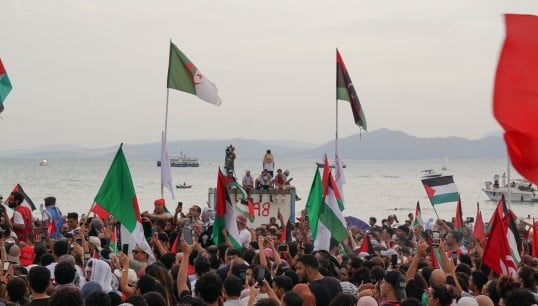 A crowd welcomes elements of the Global Sumud Flotilla to Tunisia, before it was intercepted in international waters. Image: Wikimedia Commons Image:A crowd welcomes elements of the Global Sumud Flotilla to Tunisia, before it was intercepted in international waters. Image: Wikimedia Commons