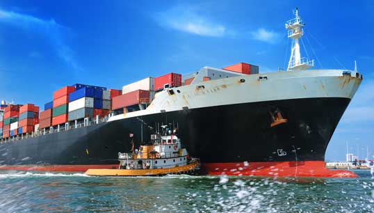 American pilot vessel pushes a container ship into a Seattle seaport. Image: Getty Images Image:American pilot vessel pushes a container ship into a Seattle seaport. Image: Getty Images