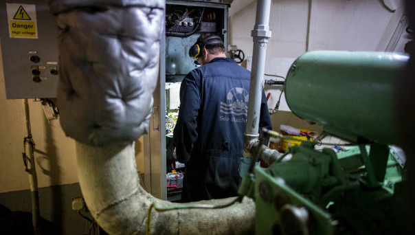 The Dutch-flagged Sea-Watch 3 NGO vessel's chief engineer works on an electrical panel following an anchor winch failure on 30 January 2019 off Syracuse, Sicily. Photo: Federico Scoppa/AFP/Getty Images Image:The Dutch-flagged Sea-Watch 3 NGO vessel's chief engineer works on an electrical panel following an anchor winch failure on 30 January 2019 off Syracuse, Sicily. Photo: Federico Scoppa/AFP/Getty Images