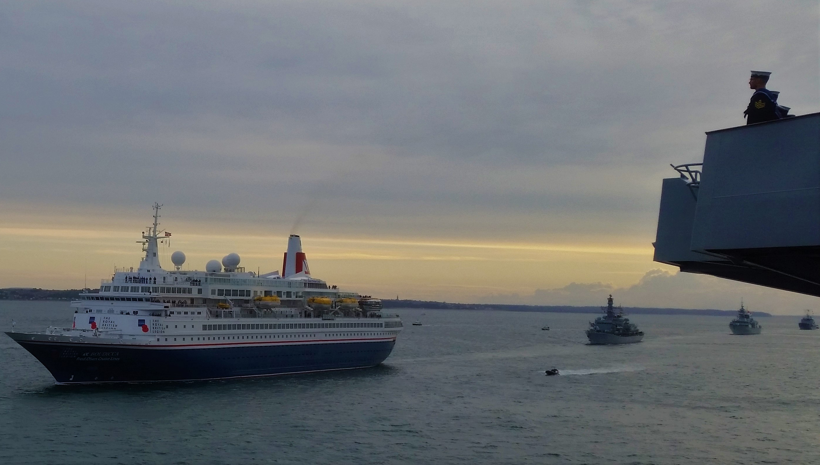 The RFA replenishment vessel Fort Victoria led a sail-past of naval ships to honour the D-Day veterans onboard the Fred Olsen passengership Boudicca. Image:The RFA replenishment vessel Fort Victoria led a sail-past of naval ships to honour the D-Day veterans onboard the Fred Olsen passengership Boudicca.