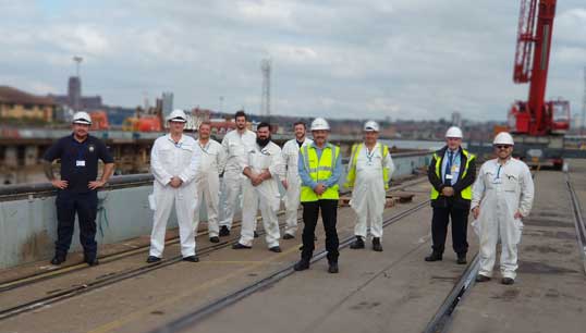 Dave Gatenby (second from right) and Steve Doran (fourth from right) with and members of the Wave Knight crew and members from other RFA ships in Cammel Laird. Image:Dave Gatenby (second from right) and Steve Doran (fourth from right) with and members of the Wave Knight crew and members from other RFA ships in Cammel Laird.