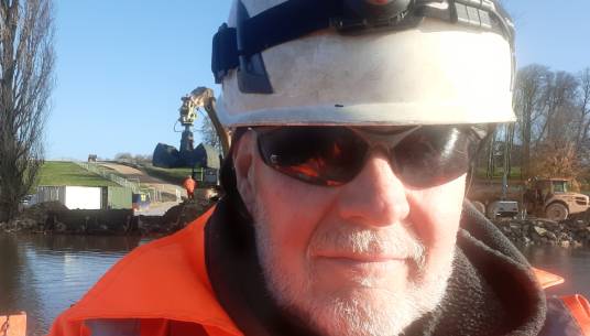 Image: Rory MacLean, while dredging on Blenheim Palace Lake.  Images: Rory MacLean