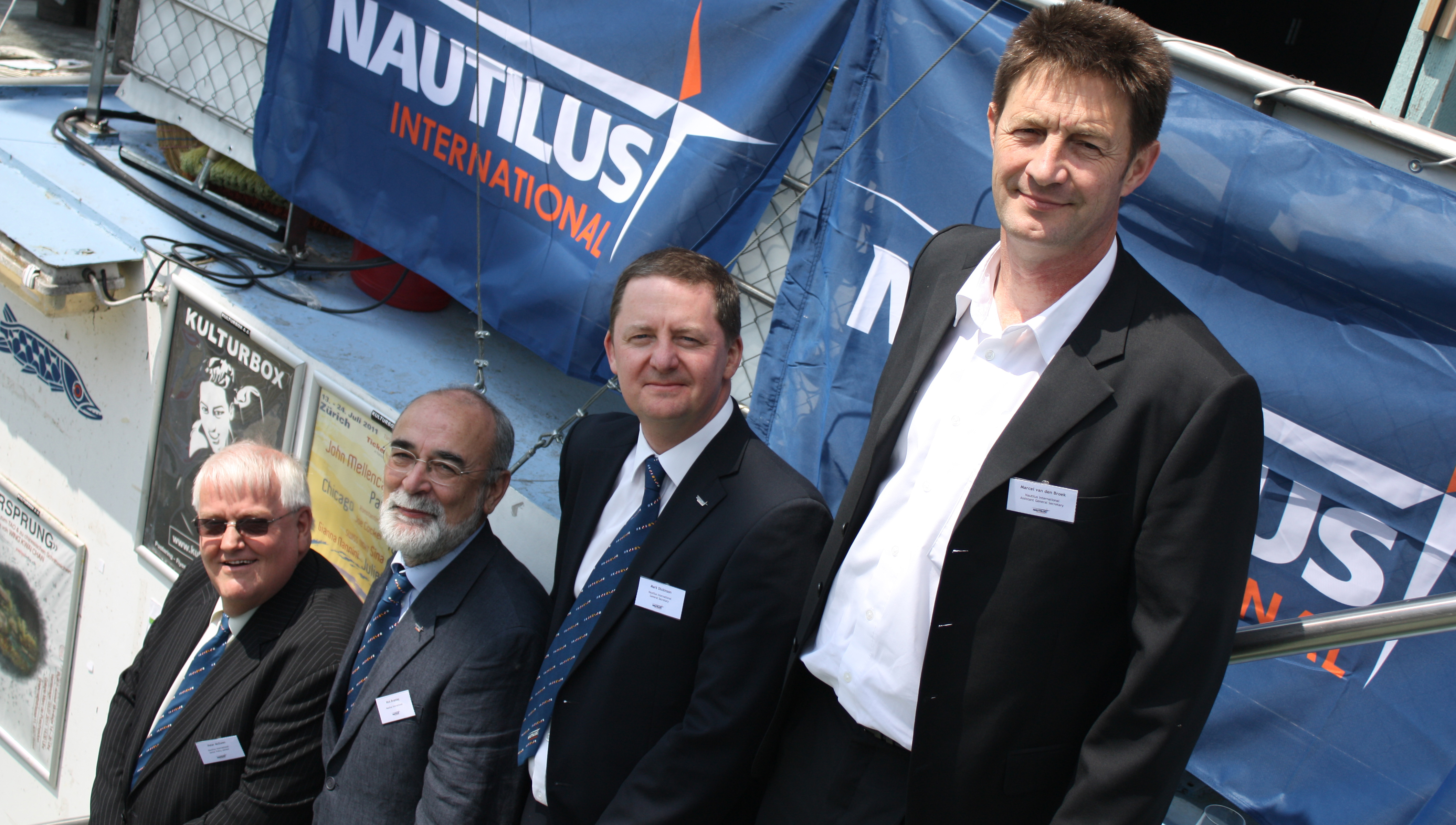 Ten years at the top from left: Peter McEwen, a former deputy general secretary, Nick Bramley former head of the Swiss branch, Mark Dickinson current general secretary, Marcel van den Broek current deputy general secretary Netherlands branch. Image:Ten years at the top from left: Peter McEwen, a former deputy general secretary, Nick Bramley former head of the Swiss branch, Mark Dickinson current general secretary, Marcel van den Broek current deputy general secretary Netherlands branch.
