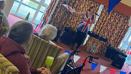 Sandra Currie leads the Nautilus Mariners' Park Care Home residents' VE Day sing-along. Image:Sandra Currie leads the Nautilus Mariners' Park Care Home residents' VE Day sing-along.