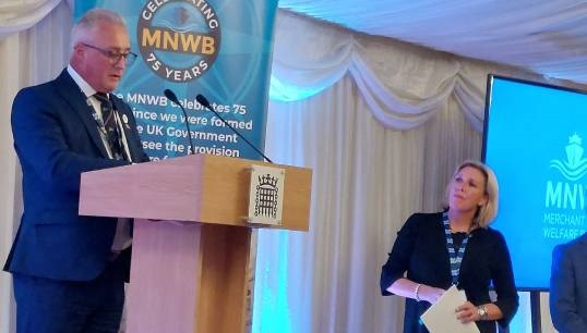 Chief executive of the MNWB Stuart Rivers addresses the charity's 75th anniversary event at Westminster. Watching (right) is maritime minister Baroness Vere of Norbiton. Image: Nautilus International Image:Chief executive of the MNWB Stuart Rivers addresses the charity's 75th anniversary event at Westminster. Watching (right) is maritime minister Baroness Vere of Norbiton. Image: Nautilus International