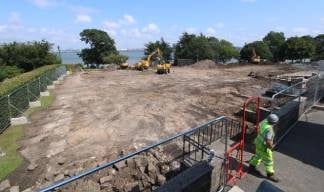 The cleared site with views towards the River Mersey. The hedge visible at left runs beside Manor Lane, used to access the promenade. Image: Time-lapse Manchester Image:The cleared site with views towards the River Mersey. The hedge visible at left runs beside Manor Lane, used to access the promenade. Image: Time-lapse Manchester